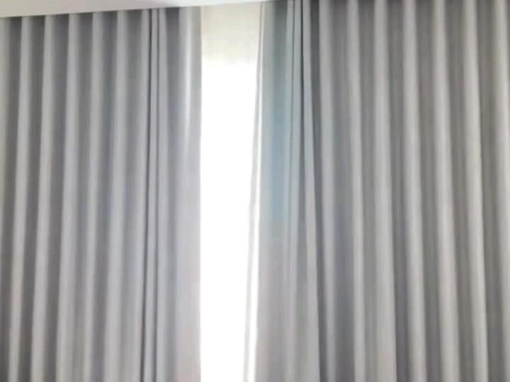 Motorised curtains opening to let in daylight